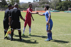 Two captains shake hands before game in Kayamandi